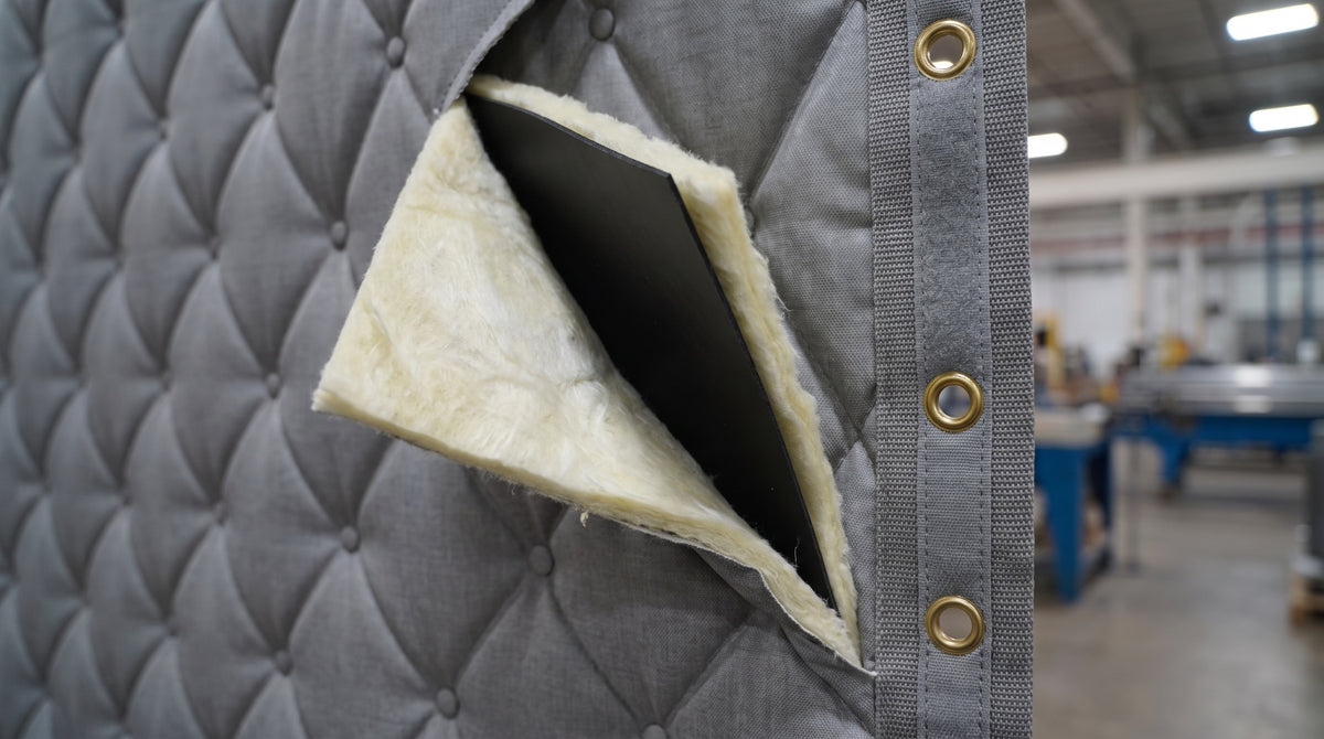 Cutaway of the curtain edge showing quilted face, fiberglass batting and mass loaded vinyl core